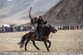 Kazakh hunter to the hare with Golden eagle - Berkutchi, in the desert foothills of Western Mongolia