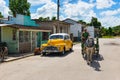 American yellow 1946 Chevrolet Fleetmaster vintage car with white roof parked on the side street in Sagua la Grande Cuba - Serie C