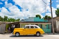 American yellow 1946 Chevrolet Fleetmaster vintage car with white roof parked on the side street in Sagua la Grande Cuba - Serie C