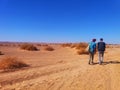 Walking under the sun at Sahara Desert Royalty Free Stock Photo