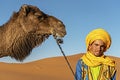 SAHARA DESERT, MOROCCO, APRIL 13, 2016. Tuareg man portrait with Royalty Free Stock Photo