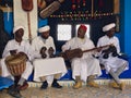 Sahara Desert, Morocco - August 2019:Four Gnawa musicians playing krakebs in Khamlia village in Sahara Desert, Morocco