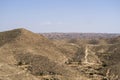 Sahara desert - rocks and route Royalty Free Stock Photo