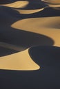 Sahara desert sand dunes with dark shadows. Royalty Free Stock Photo