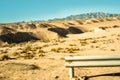 Sahara, the road in the desert, Africa, Egypt. Dirt and trash in the desert, plastic in the sand. yellow sand and blue Royalty Free Stock Photo