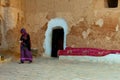 06.11.26 Sahara, Tunisia: Berber woman in traditional clothes bake bread at home. Native Local Tunisian People