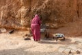 06.11.26 Sahara, Tunisia: Berber woman in traditional clothes bake bread at home. Native Local Tunisian People