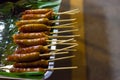 Sai Aua Notrhern Thai Spicy Sausage, Grilled sausages on a banana leaf cuisine of northern Thailand,  Thai street food. Royalty Free Stock Photo