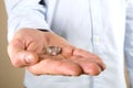 Engagement / marriage / wedding proposal scene. Close up of man handing the expensive gold platinum diamond ring to his bride. Royalty Free Stock Photo