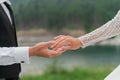 She said yes concept. Suited up man fiance groom hands stylish platinum white gold proposal engagement wedding ring to Royalty Free Stock Photo