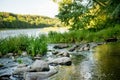 Saide stream falling into Neris river in Neris Regional Park near Vilnius, on sunny summer day