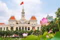 Saigon City Hall or Ho Chi Minh City People`s Committee with pink lotus flowers Royalty Free Stock Photo