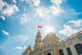 Saigon City Hall with waving Vietnamese flag