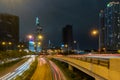 Saigon Cityscape Nighttime. Urban Metropolis with illuminated road and Bitexco Financial Tower at Background. Saigon Royalty Free Stock Photo