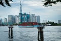 Saigon pearl a residential luxury complex, view from the river with a cargoboat crossing, and cloudy sky, ho chi minh city