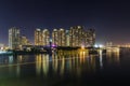 SAIGON, VIETNAM - DEC 27, 2016 - Night on the Saigon River, across the river is Saigon Pearl luxury apartment and a big constructi