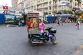 SAIGON, VIETNAM - JAN 23, 2017 - An unidentified vendor pushes a mobile kitchen on a street in the Nguyen Hue walking street