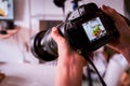 Saigon/Vietnam, 13 July 2018 - A photographer taking food photos with DSLR Camera in a Food studio Royalty Free Stock Photo