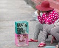 Saigon, Vietnam - June 2017: woman selling caged birds for good luck, Saigon, Vietnam. Royalty Free Stock Photo