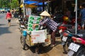 SAIGON, VIETNAM - October 16, 2014: A garbage collector collecting carton boxes on a small street, Saigon, Vietnam