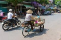 SAIGON, VIETNAM - October 16, 2014: Street vendor on a small street, Saigon, Vietnam.