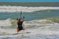 A sail boarder navigating the surf on the Gulf of Mexico in Indian Rocks Beach, Florida