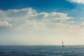 Sail boat in the foggy sea in a calm early morning Royalty Free Stock Photo