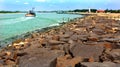 Sail the boat in the karaikal beach with stone way and light house. Royalty Free Stock Photo