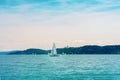 Sail boat on the lake Balaton view of Tihany abbey from Balatonfured before sunset Royalty Free Stock Photo