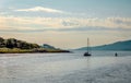 A sail boat leaves Loch Aline behind Royalty Free Stock Photo