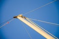 Sail boat mast, bracing, hemp ropes, blue sky. Minimalist maritime theme. History of water transport Royalty Free Stock Photo