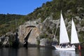 Sail boat near the Maori Rock Carving at lake Taupo New Zealand