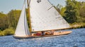 A trio of sailors participating in a brown boat race on Wroxham Broad Royalty Free Stock Photo