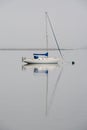 Sail boat reflected in the water Royalty Free Stock Photo