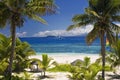 Sail boat seen through palm trees, Mamanuca Group islands, Fiji Royalty Free Stock Photo