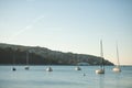 Sail boats anchored on a calm sea in late afternoon Royalty Free Stock Photo