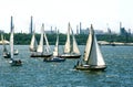 Sail boats on the background of the pipes metallurgical plant