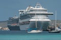 Sail boats and large cruise ships docked at the port of Klarendijk