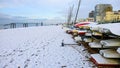 Sail boats on a pebble beach on a frozen snowy frosty morning