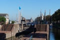 Sail boats stands moored near the river promenade of Muiden