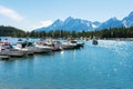 Sail boats and yachts docked at Colter Bay Marina. Scenic view of Jackson Lake and Teton Range mountains. - Moran, Wyoming, USA -