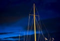 Sail masts against night blue sky. Royalty Free Stock Photo