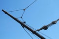 Sail rigging bowsprit and pulleys, black on blue, horizontal orientation Royalty Free Stock Photo