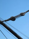 Sail rigging pulleys, black on blue Royalty Free Stock Photo