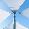 Sunshade sails over blue sky, square photo image. Royalty Free Stock Photo