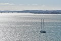 Sail ship on silver ocean