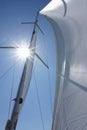 Sail tack with a sailing yacht in the wind with blue sky.