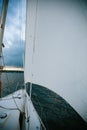 Sail a yacht against the blue sky Royalty Free Stock Photo