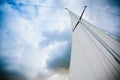 Sail a yacht against the blue sky Royalty Free Stock Photo