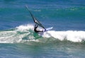 Sailboarder Windsurfing a Wave in Hawaii Royalty Free Stock Photo